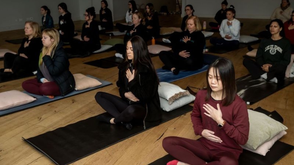 Roslyn Foo deep in breathwork practise led by Tanya Lee at Heal'r Greenfields Albert Park, Melbourne.