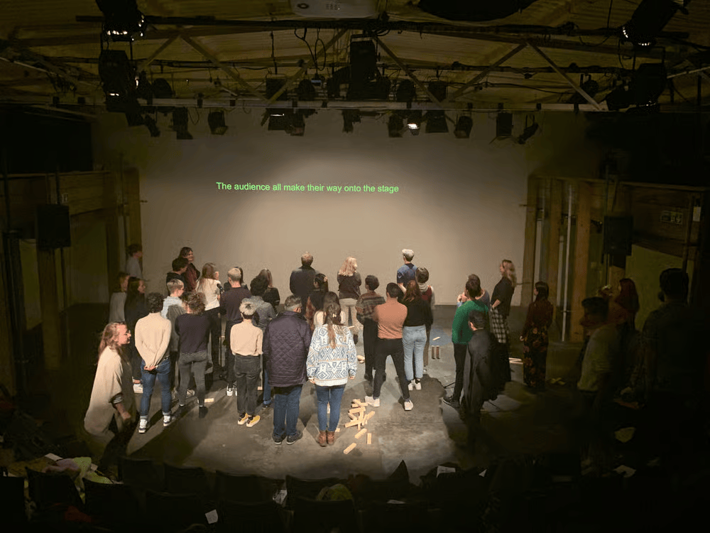 Performer reacting live to prompts during instructions at Trades Hall Melbourne Fringe