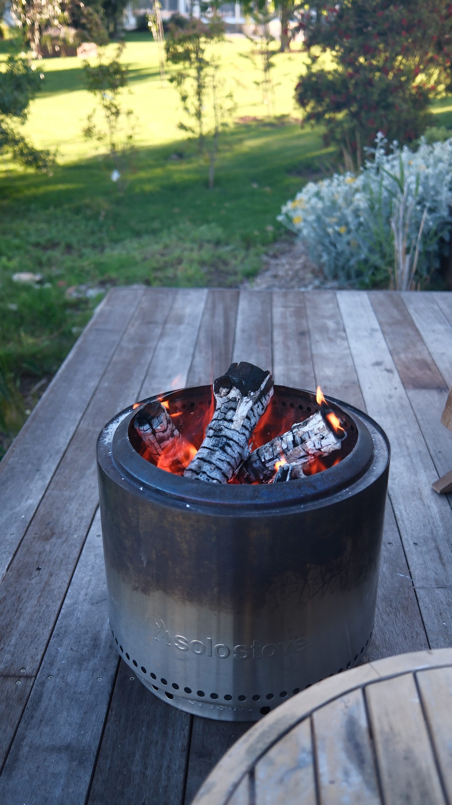Campfire setup on wooden deck at a romantic riverside retreat in Maffra Victoria