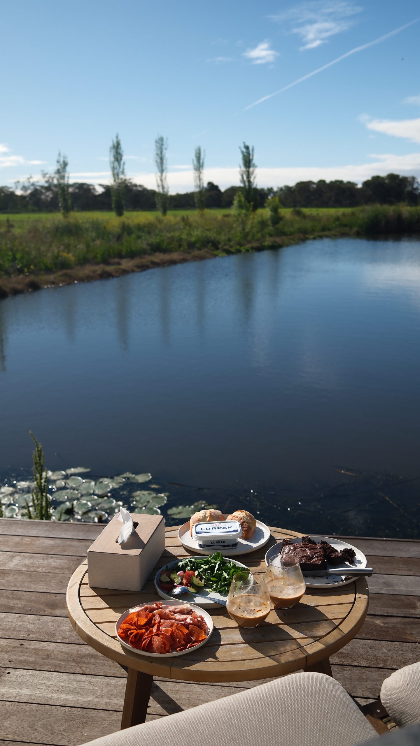 Breakfast with scenic river and green farmland in Maffra Gippsland during couple getaway