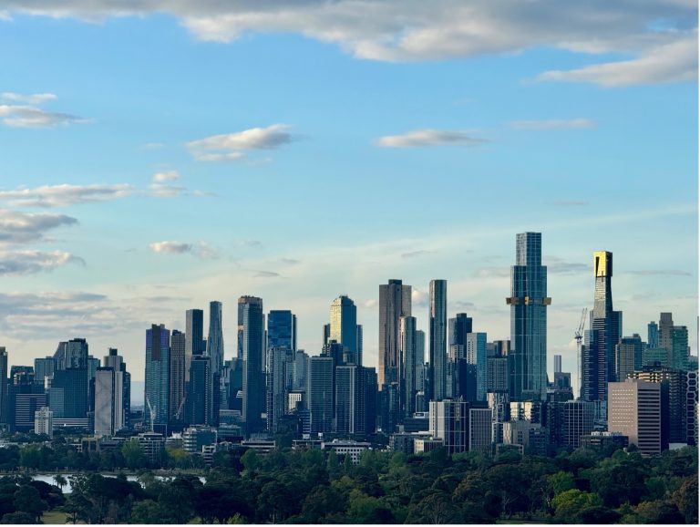 Melbourne city skyline at sunset during summer 2025