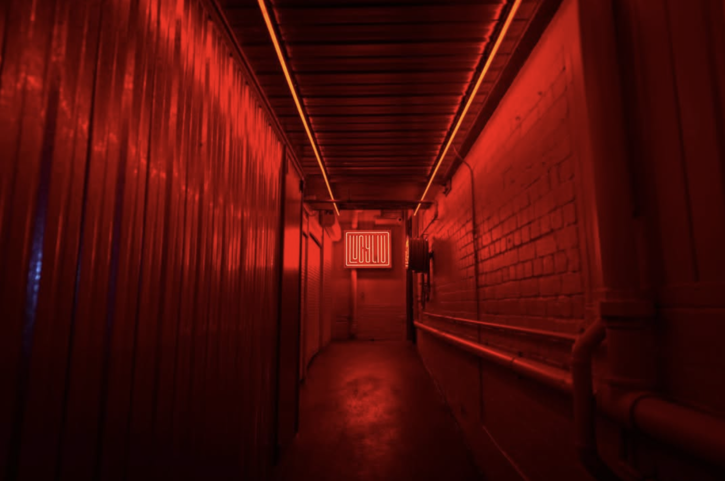 The red neon tunnel into Lucy Liu's magical modern asian escape, photograph taken from Lucy Liu's instagram