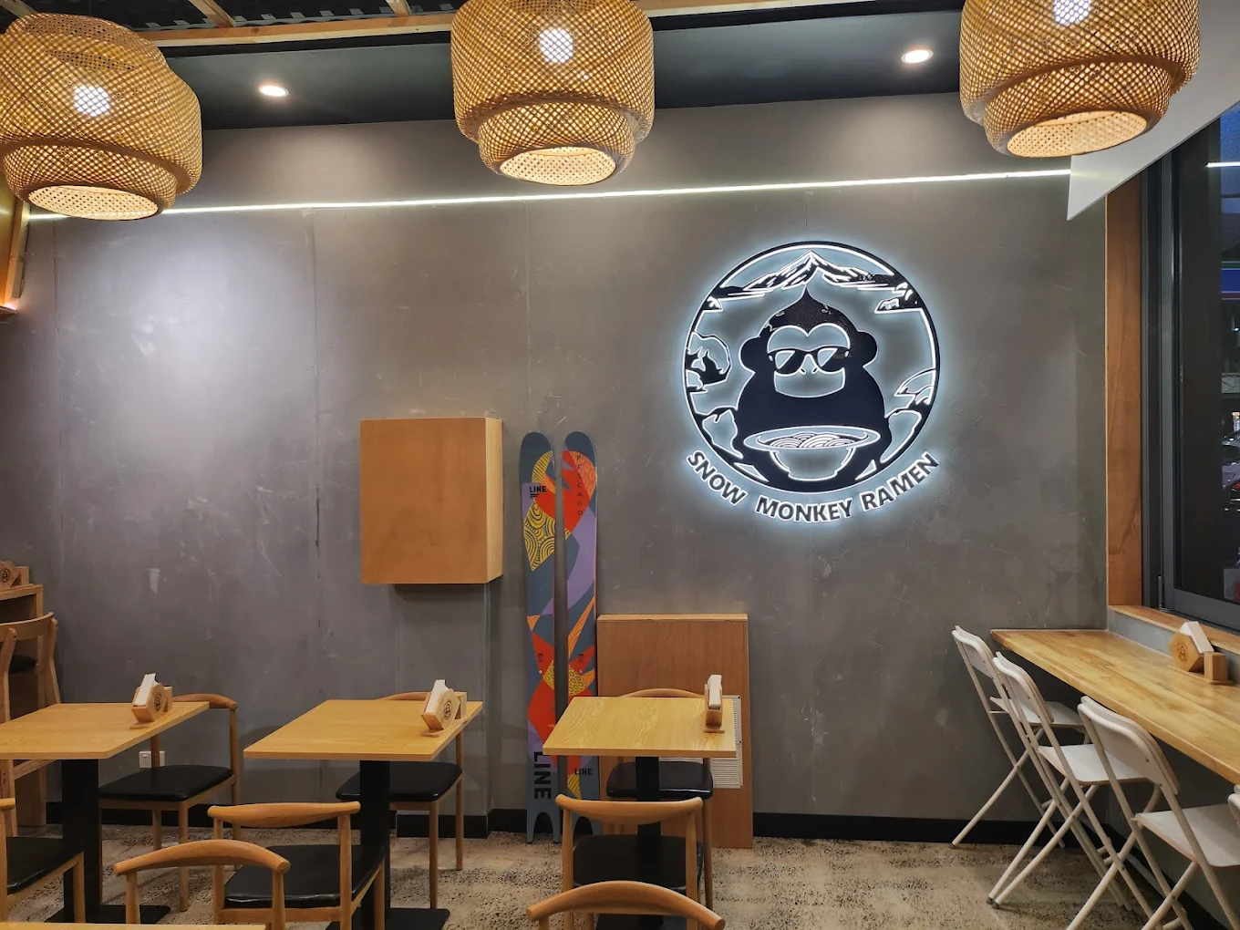 illuminated by traditional Japanese paper lanterns at night.