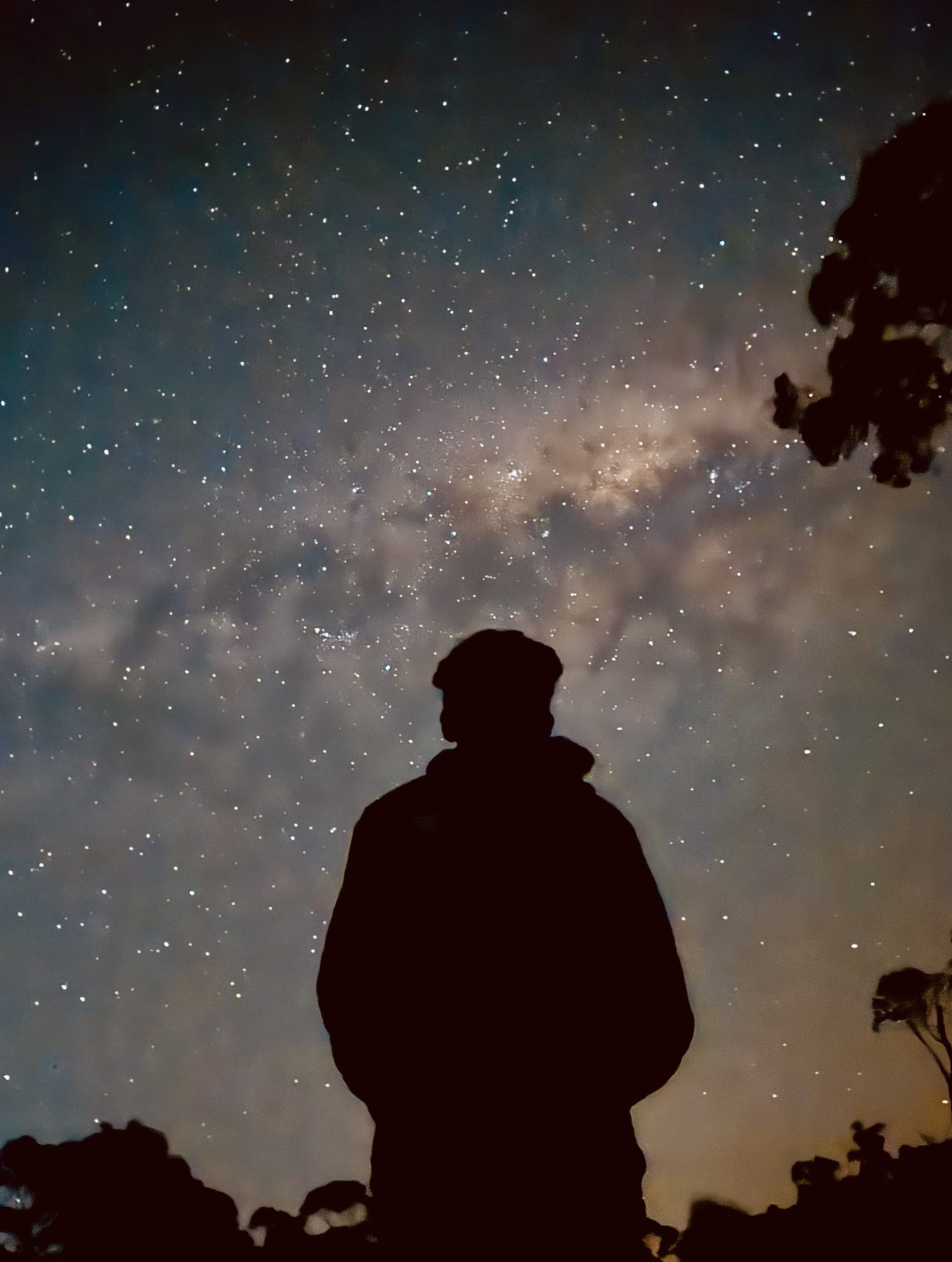 Person stargazing Melbourne night sky with the Milky Way overhead