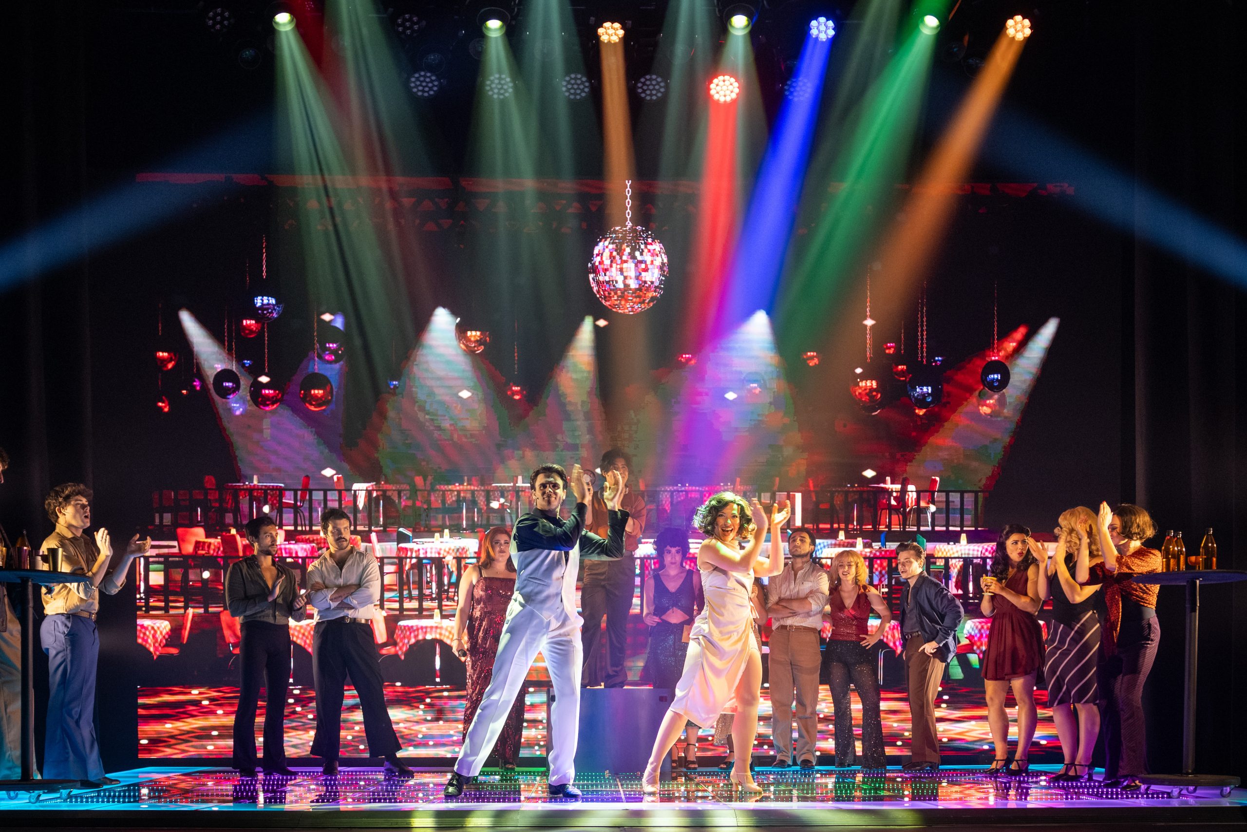 Ethan Churchill as Tony Manero dancing in Saturday Night Fever at Athenaeum Theatre