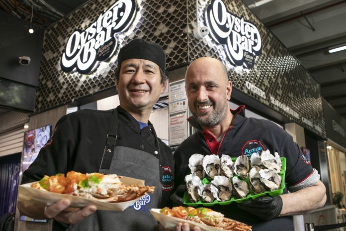 South Melbourne Market Aptus Oyster Bar chefs presenting fresh oysters and seafood platters.