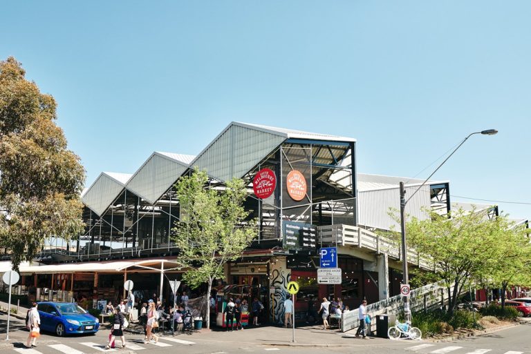 South Melbourne Market weekend exterior, people entering the famous food market.