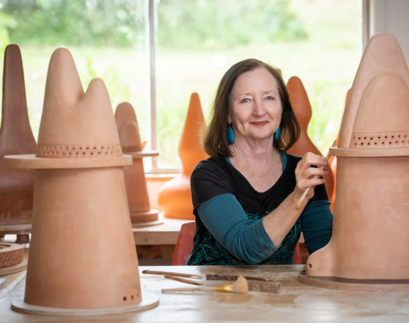Ceramic artist working with clay at Slow Clay Centre pottery workshop in Collingwood Melbourne