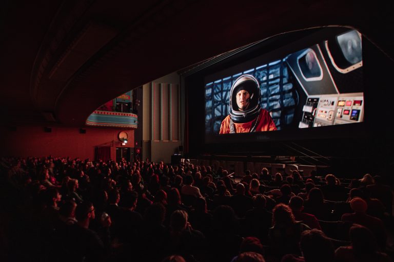 St Kilda Film Festival screening at the Palais Theatre Melbourne, audience watching short film on the big screen