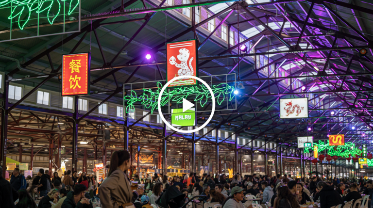 Hawker 88 Night Market Queen Victoria Market Melbourne indoor sheds with neon lights lanterns and communal dining tables