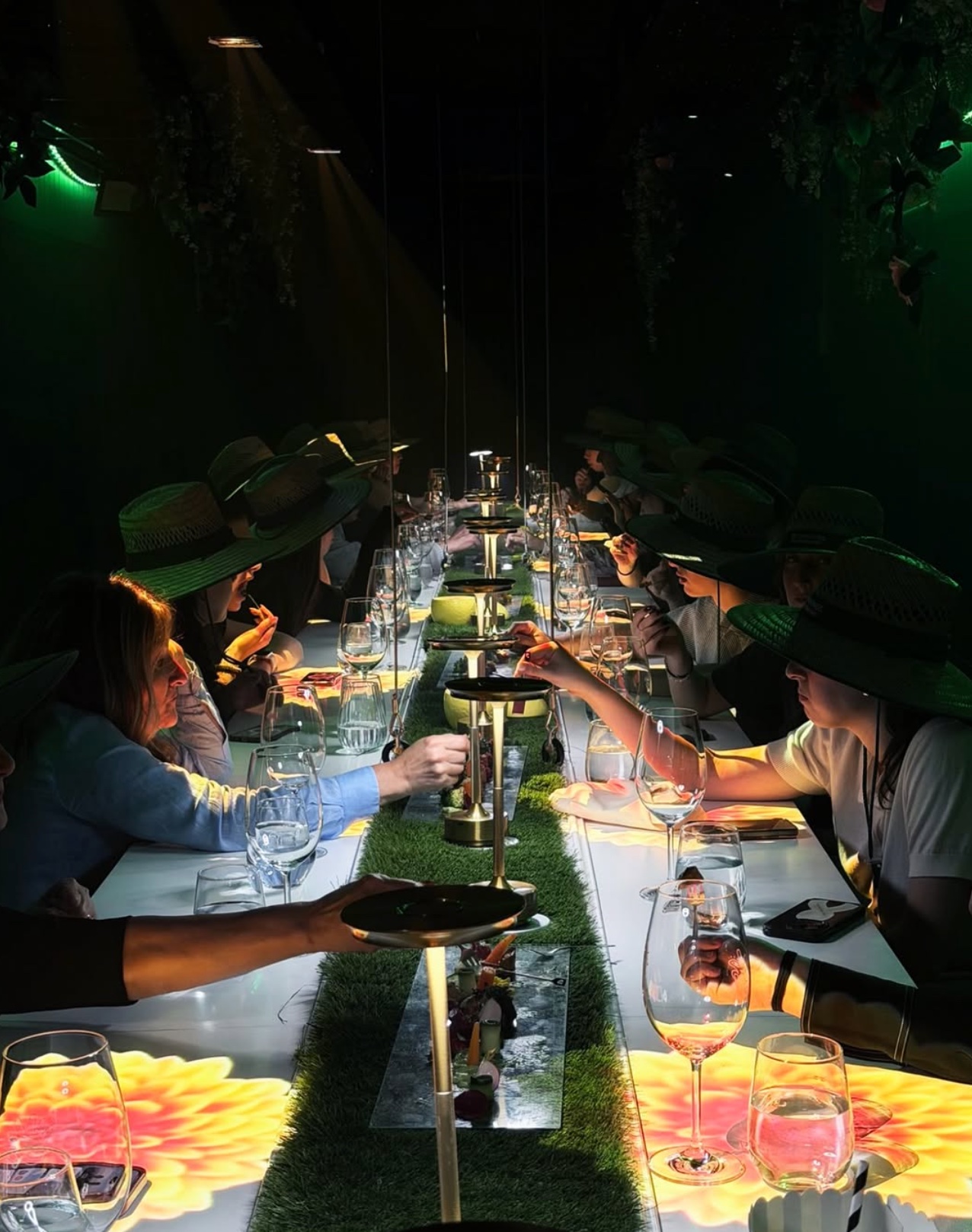 Guests seated at one long communal table during Shelly immersive multi-sensory dining experience in Caulfield Melbourne