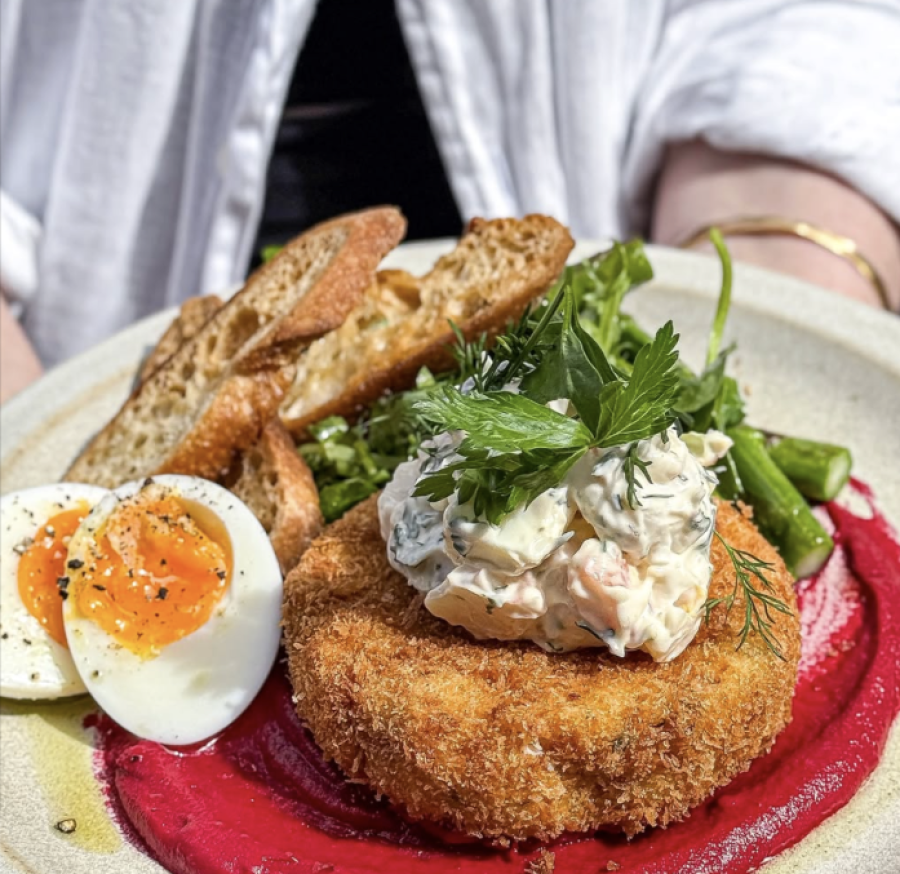 Hardware Société Melbourne brunch — crumbed salmon cake with soft-boiled egg and sourdough toast