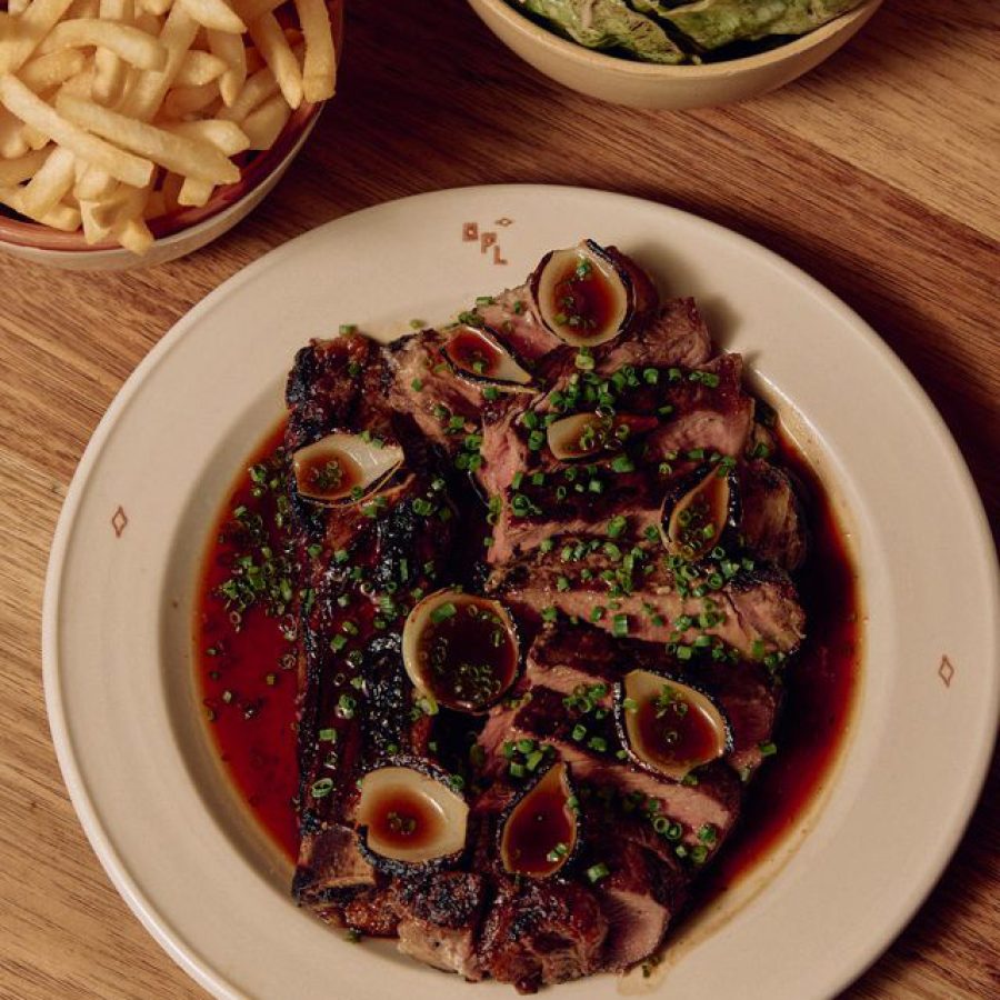 Wood fire steak Melbourne — sliced grilled ribeye with chives and jus at Old Palm Liquor Brunswick