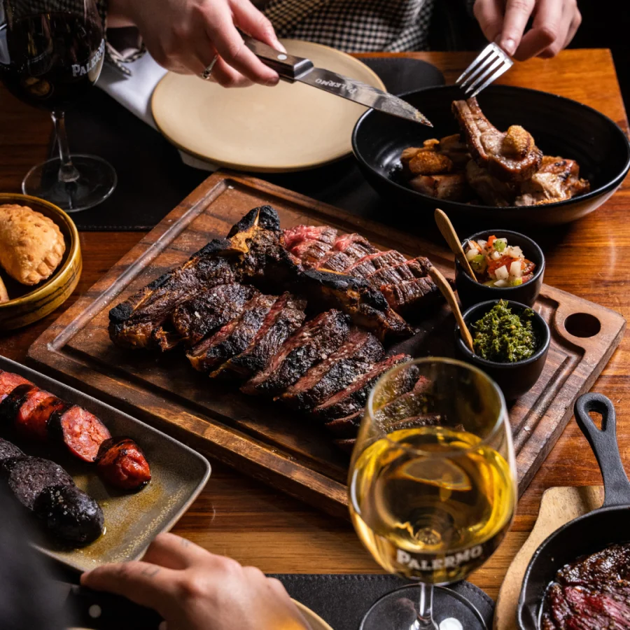 Argentine steak restaurant Melbourne — parrilla mixed grill board with chorizos, morcilla and chimichurri at Palermo